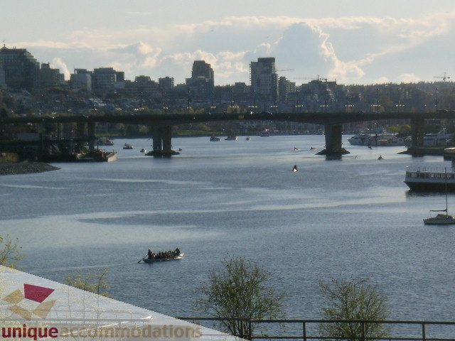 Bright living room with a stunning city view and waterfront access. - 305 - 1030 Quebec Street, Vancouver Downtown