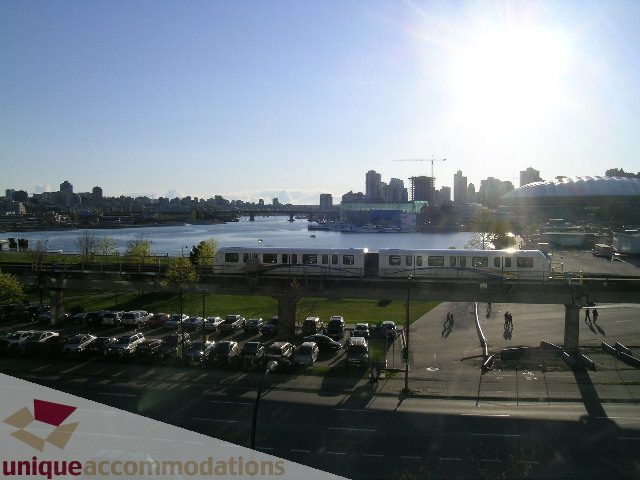 Bright living room with city view and modern furnishings. - 305 - 1030 Quebec Street, Vancouver Downtown