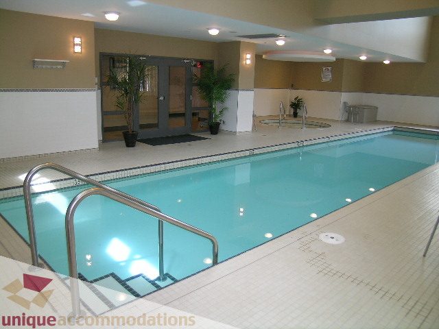 Spacious indoor pool area with tiled floors and modern decor. - 305 - 1030 Quebec Street, Vancouver Downtown