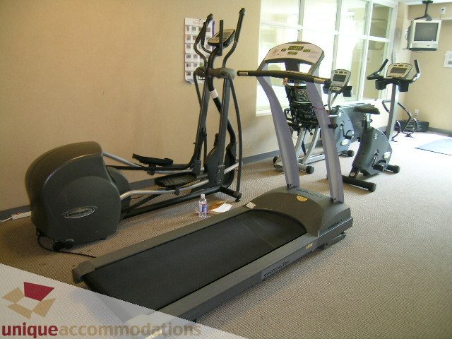 Bright gym with cardio equipment and large windows. - 305 - 1030 Quebec Street, Vancouver Downtown