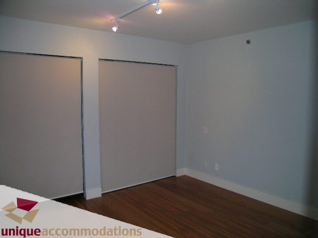 Bright living room with hardwood floors and sliding doors. - 2234 York Ave, Vancouver West Side