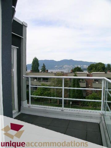 Furnished balcony with city view and greenery. - 2234 York Ave, Vancouver West Side