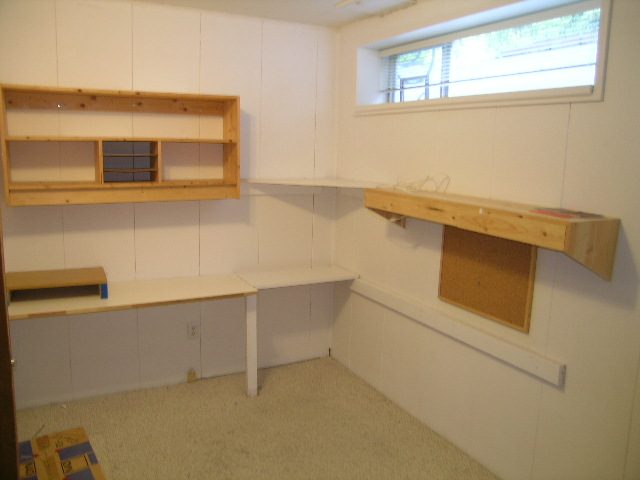 Bright kitchen with light wood cabinets and countertop, featuring a window above. - 660 Blueridge Ave, North Vancouver