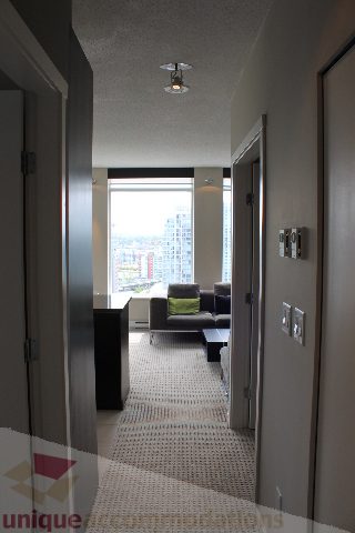 Furnished living room with city view and modern decor. - 2103 - 1001 Homer Street, Vancouver Downtown