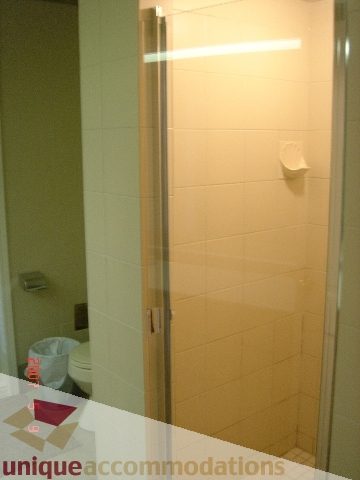 Bathroom with tiled walls and a shower area. - 100 Lions Bay Avenue, West Vancouver