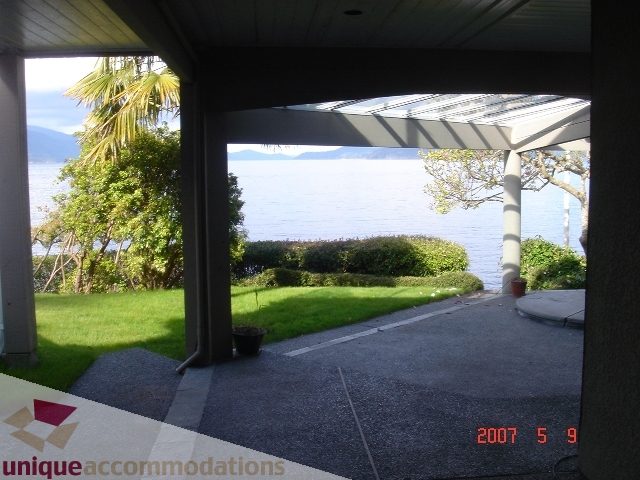 Furnished patio with a view of the ocean and greenery. - 100 Lions Bay Avenue, West Vancouver