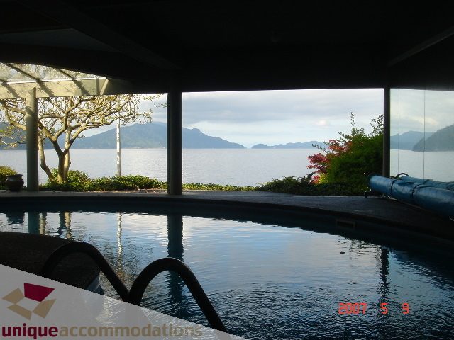 Spacious living room with stunning ocean view and modern furnishings. - 100 Lions Bay Avenue, West Vancouver