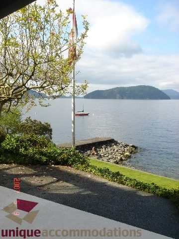 Furnished living room with a view of Lions Bay and mountains. - 100 Lions Bay Avenue, West Vancouver