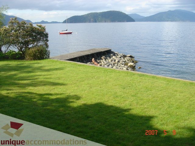 Furnished living room with a view of the water and mountains. - 100 Lions Bay Avenue, West Vancouver