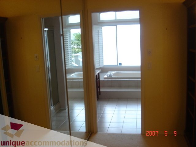 Bright kitchen with tiled floor and large window, natural light flooding in. - 100 Lions Bay Avenue, West Vancouver