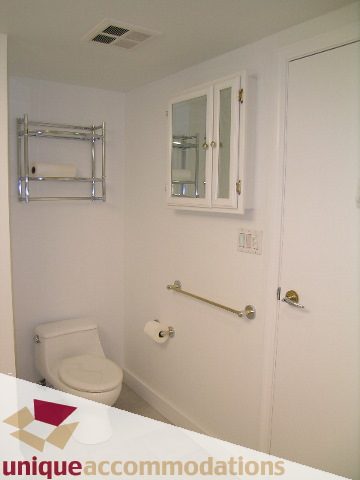 Bathroom with white walls, toilet, and medicine cabinet. - 2C - 199 Drake Street, Vancouver Downtown