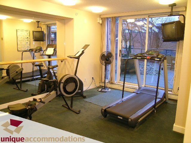 Bright and spacious fitness room with cardio machines and large windows. - 2C - 199 Drake Street, Vancouver Downtown