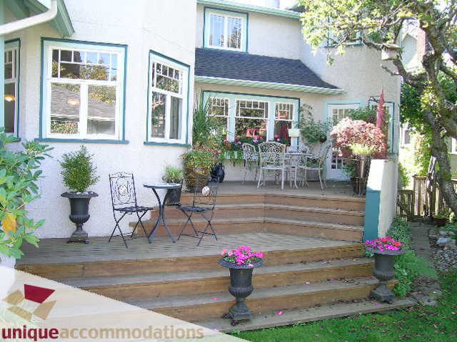 Furnished patio with steps, potted plants, and outdoor seating. - 4177 West 15th Avenue, Vancouver West Side