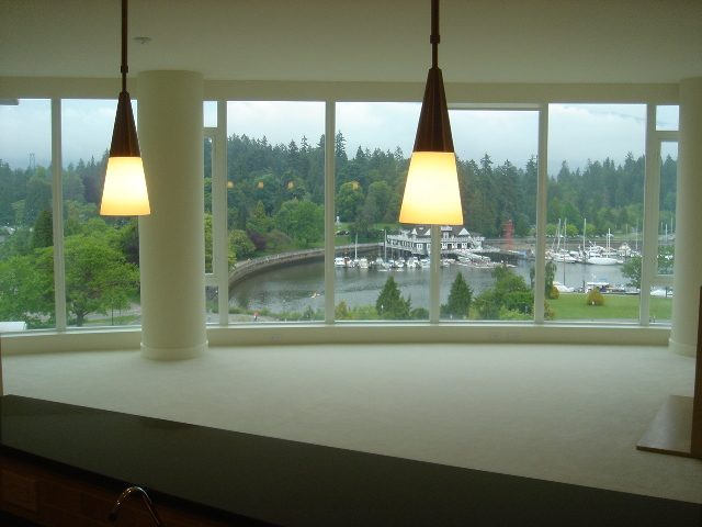 Bright kitchen with modern pendant lights and a view of the marina and forest. - 902 - 1925 Alberni Street, Vancouver Downtown