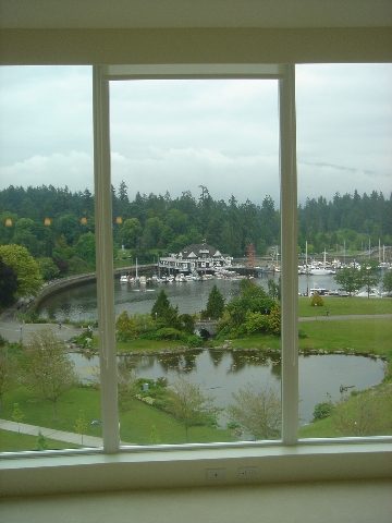 Bright living room with a stunning view of the marina and greenery. - 902 - 1925 Alberni Street, Vancouver Downtown