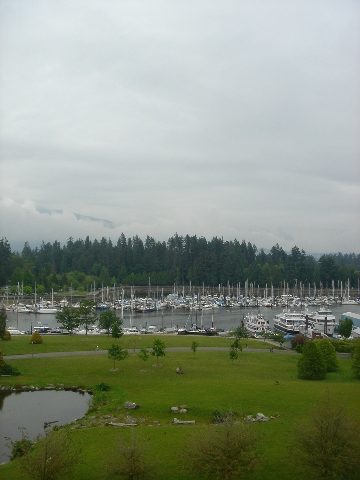 Bright living room with city view and marina, serene park-like setting. - 902 - 1925 Alberni Street, Vancouver Downtown