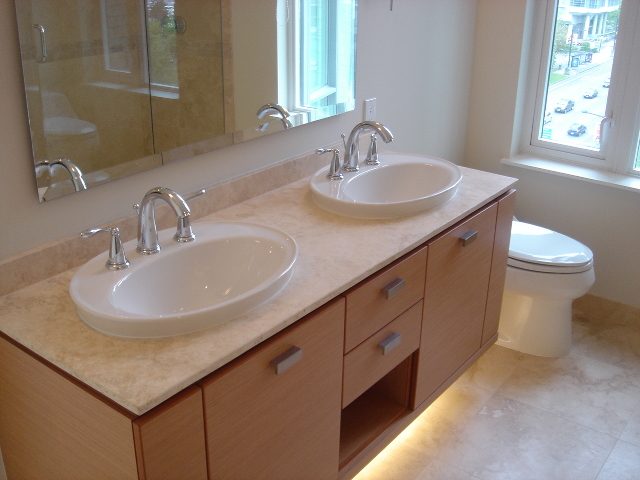Bright bathroom with dual sinks, marble countertop, and city view. - 902 - 1925 Alberni Street, Vancouver Downtown
