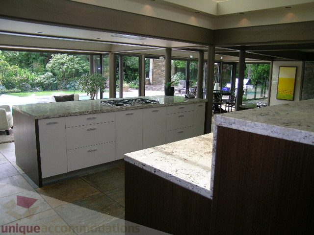 Modern kitchen with granite countertops and large windows. - 455 Keith Road, West Vancouver