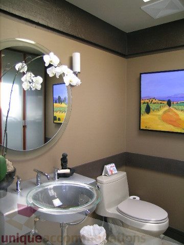 Bathroom with modern decor, glass sink, and wall art. - 455 Keith Road, West Vancouver