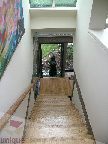 Staircase leading to outdoor patio with garden view. - 455 Keith Road, West Vancouver