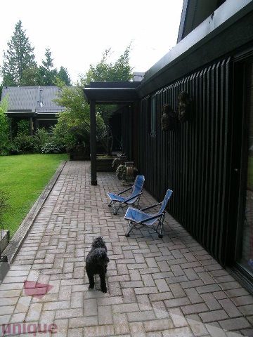 Furnished patio with brick flooring and outdoor seating. - 455 Keith Road, West Vancouver