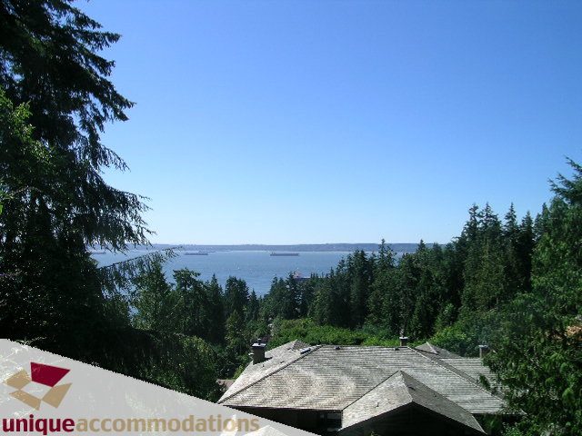 Furnished living room with a stunning view of the ocean and forest. - 3580 Westmount Court, West Vancouver