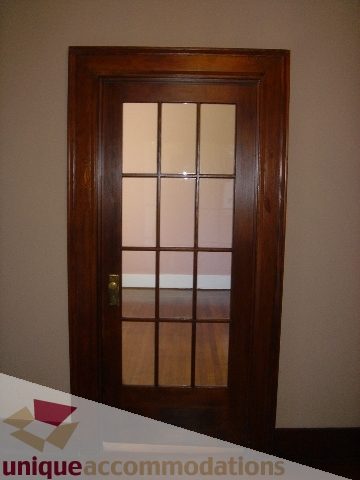 Framed door with glass panels leading to hardwood floors. - 1475 W 33rd Ave, Vancouver West Side