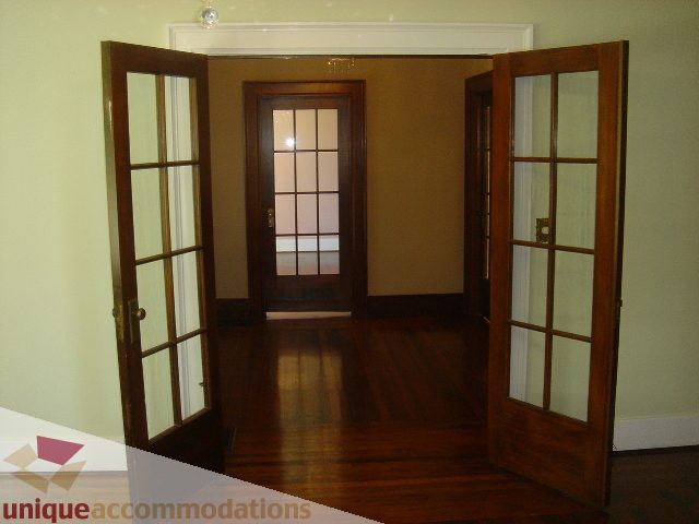 Foyer with hardwood floors and French doors leading to another room. - 1475 W 33rd Ave, Vancouver West Side