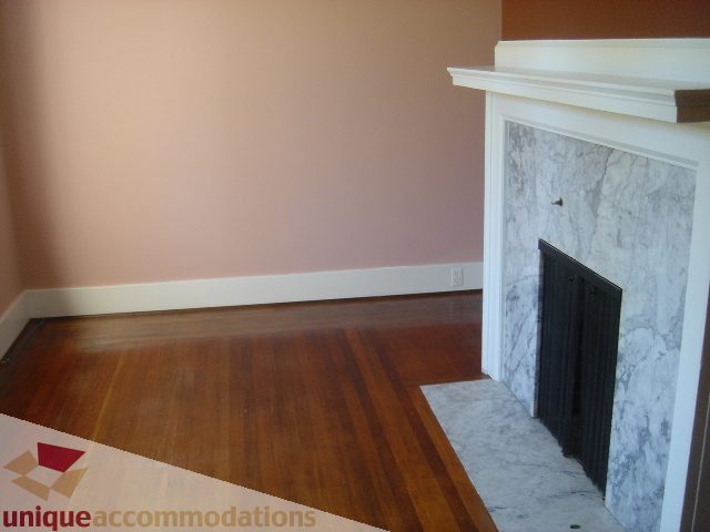Bright living room with hardwood floors and marble fireplace. - 1475 W 33rd Ave, Vancouver West Side