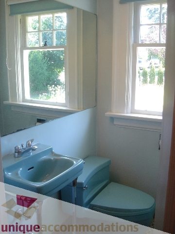Bathroom with vintage blue fixtures and large windows. - 1475 W 33rd Ave, Vancouver West Side