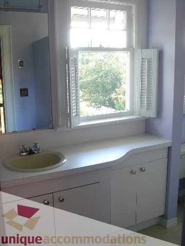 Bathroom with white vanity and large window view. - 1475 W 33rd Ave, Vancouver West Side