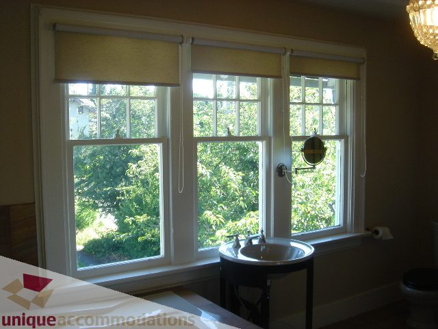 Bathroom with large windows, natural light, and a sink. - 1475 W 33rd Ave, Vancouver West Side