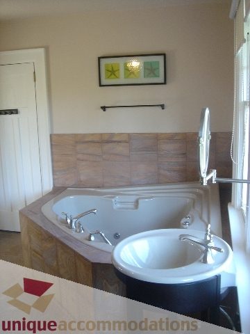 Furnished bathroom with wooden accents and modern sink. - 1475 W 33rd Ave, Vancouver West Side