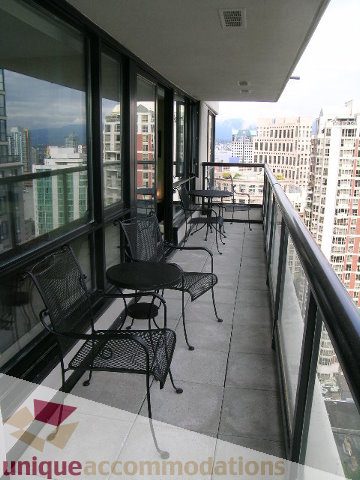 Furnished balcony with city view and outdoor seating. - 2707 - 928 Homer Street, Vancouver Downtown