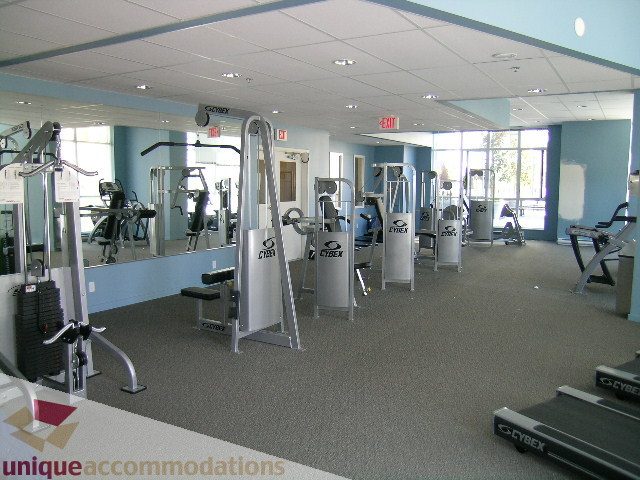 Furnished gym with cardio equipment and mirrors. - 1207 - 1155 Seymour Street, Vancouver Downtown