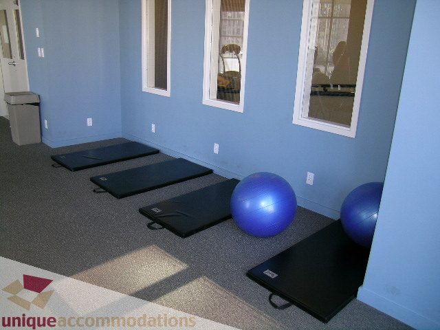 Bright exercise room with yoga mats and exercise balls, perfect for fitness enthusiasts. - 1207 - 1155 Seymour Street, Vancouver Downtown