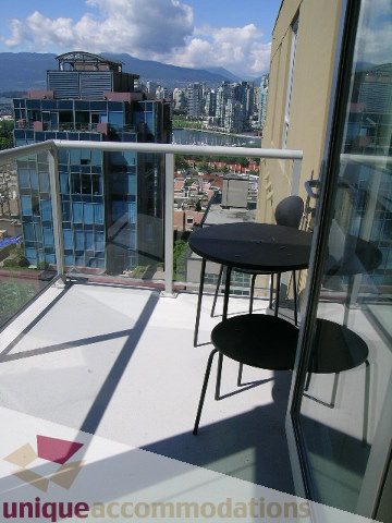 Spacious balcony with modern furniture and stunning city views. - 1204-1030 West Broadway, Vancouver West Side