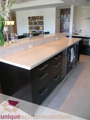 Bright kitchen with modern countertops and sleek cabinetry. - 602-1012 Beach Ave., Vancouver Downtown