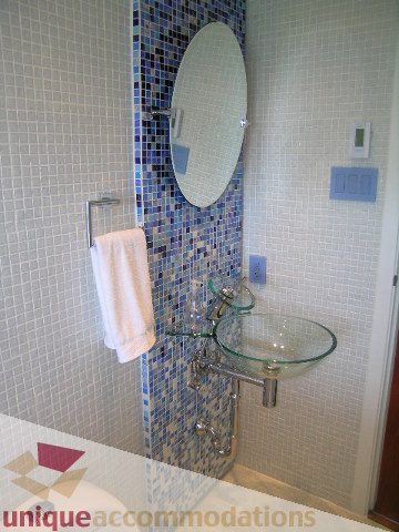 Modern bathroom with glass sink and mosaic tile backsplash. - 602-1012 Beach Ave., Vancouver Downtown