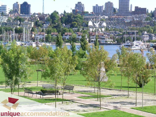 Spacious living room with a stunning city view and waterfront access. - 103-638 Beach Cres., Vancouver Downtown