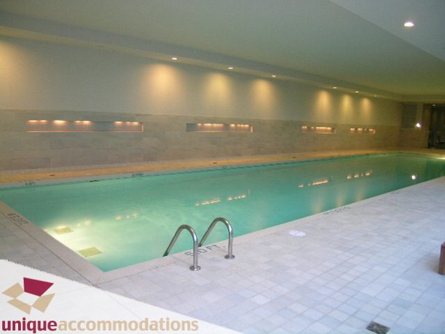 Spacious indoor pool area with tiled floors and modern lighting. - 103-638 Beach Cres., Vancouver Downtown