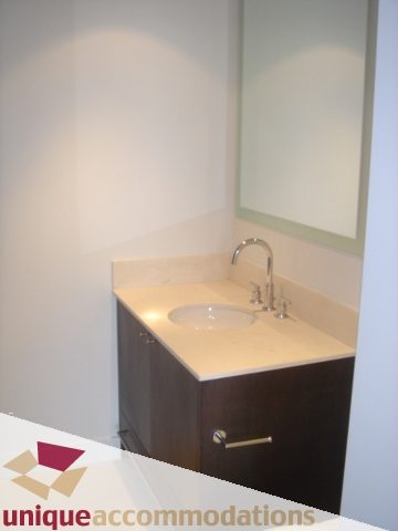 Modern bathroom with sleek countertop and minimalist design. - 1101 -1455 Howe Street, Vancouver Downtown