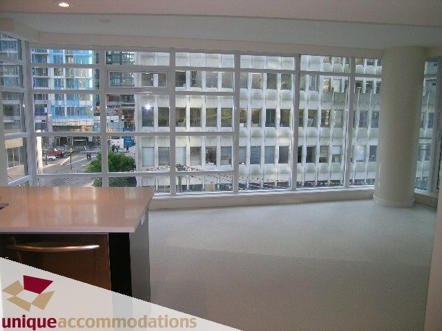 Furnished kitchen with modern countertops and city view. - 705 - 1205 W Hastings, Vancouver Downtown