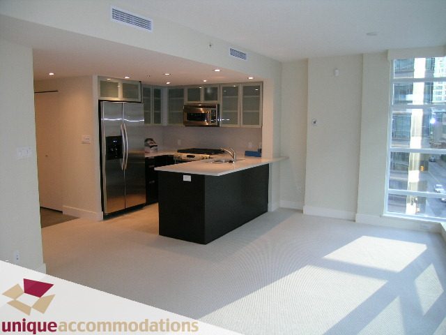 Bright kitchen with modern appliances and city view. - 705 - 1205 W Hastings, Vancouver Downtown