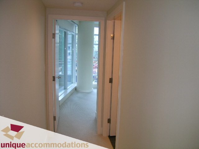 Bright hallway leading to a furnished balcony with city views. - 705 - 1205 W Hastings, Vancouver Downtown