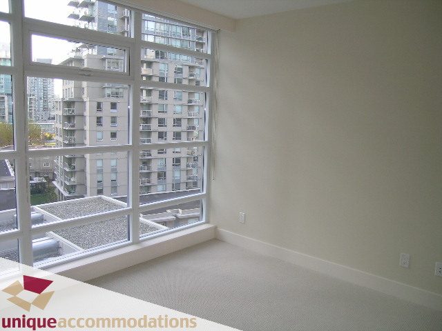 Bright living room with city view and large windows. - 705 - 1205 W Hastings, Vancouver Downtown