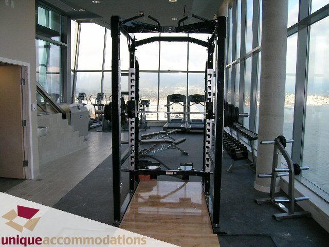 Furnished fitness room with city view and modern equipment. - 705 - 1205 W Hastings, Vancouver Downtown