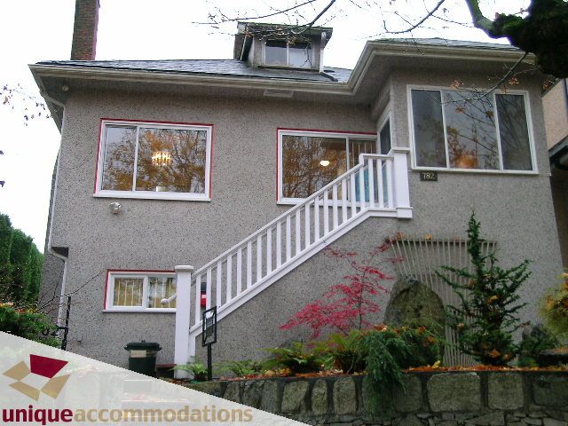 Furnished 3-bedroom + den house with white railings and red-trimmed windows. - 782 W 22nd Ave, Vancouver West Side