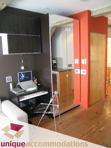 Furnished living room with hardwood floors, modern furniture, and a piano. - 211- 1216 Homer, Vancouver Downtown