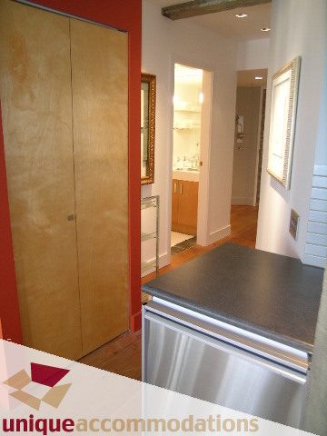 Bright kitchen with stainless steel appliances and wooden cabinets. - 211- 1216 Homer, Vancouver Downtown